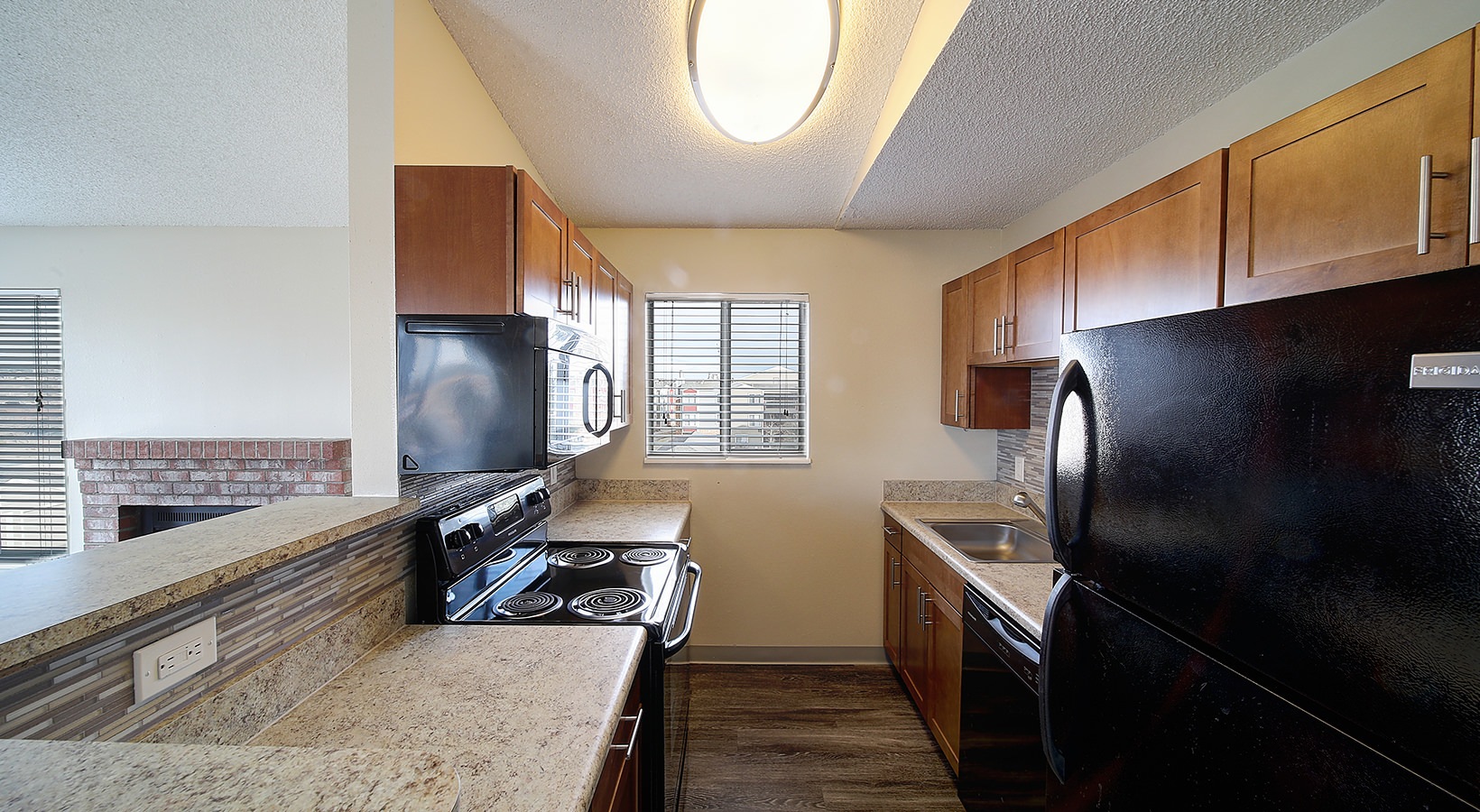 Kitchen Open kitchen and living room with plenty of natural light.