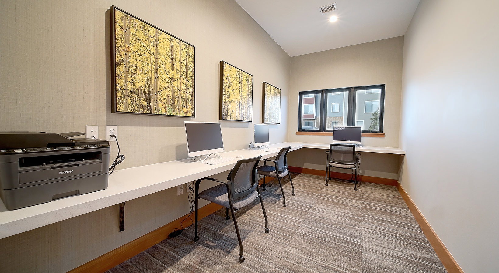 Business Center Business center with large desk and computers